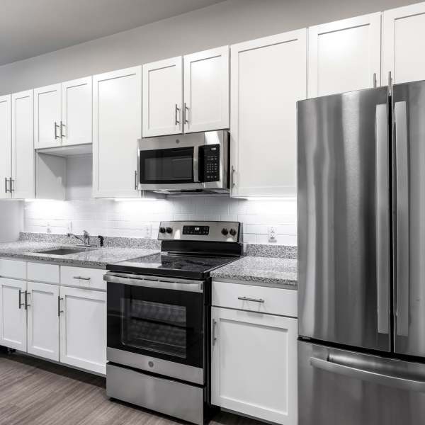 Kitchen and cabinetry in a model home at The Rail Apartments in Austin, Texas
