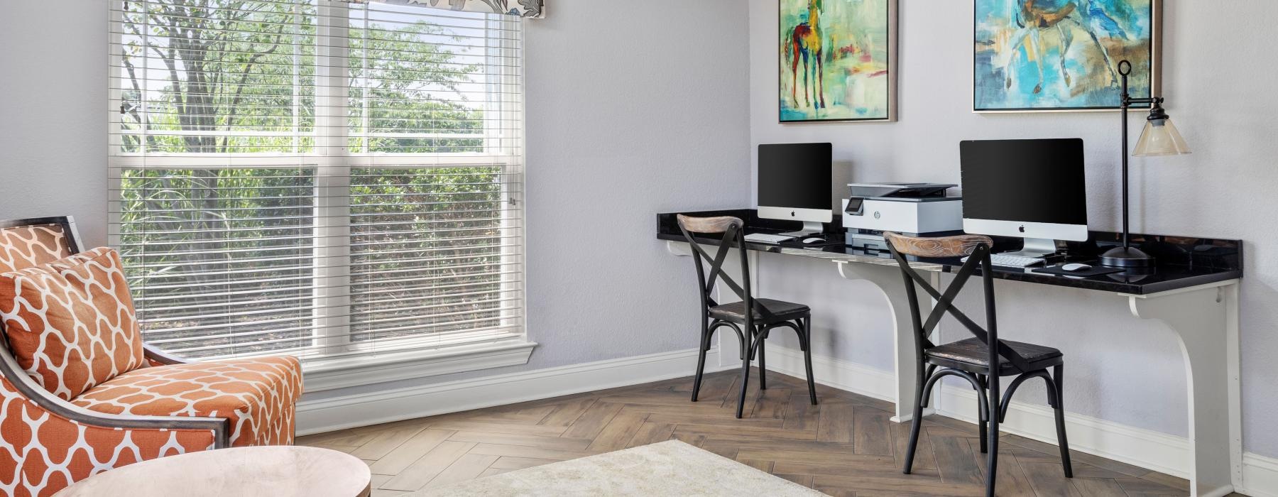 a room with a desk and computer