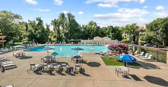 Pool With Relaxing Chairs at McDonogh Township Apartments, Owings Mills, Maryland