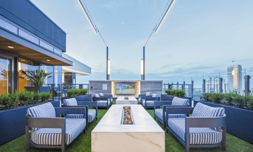 a rooftop fire pit with couches