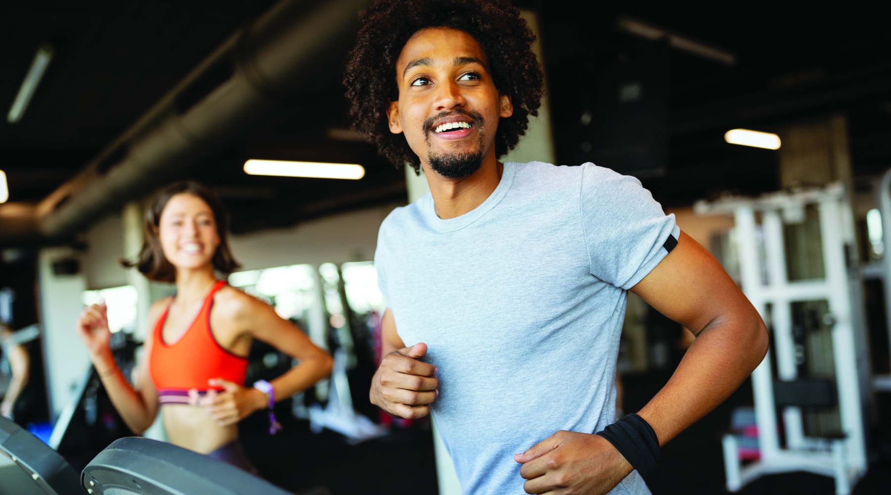 Two people run on treadmills at 17 Social apartments