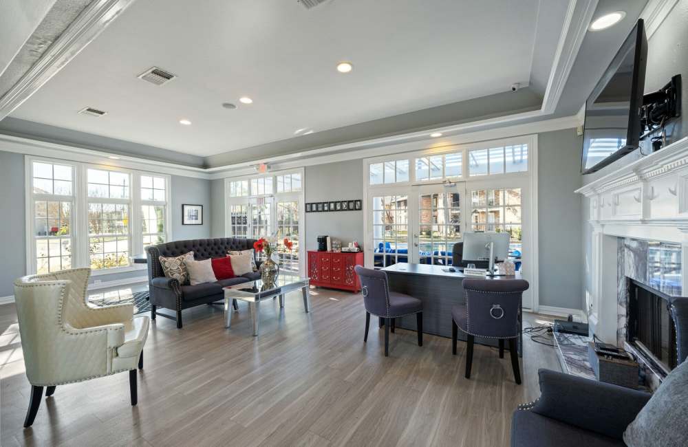 Community clubhouse with large couch and seating at Verena at Cypresswood in Spring, Texas