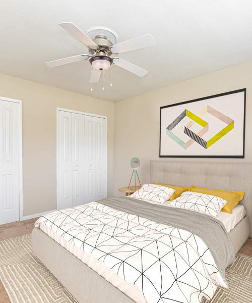Cozy bedroom at Columbia Crossing Apartments in Columbia, Missouri