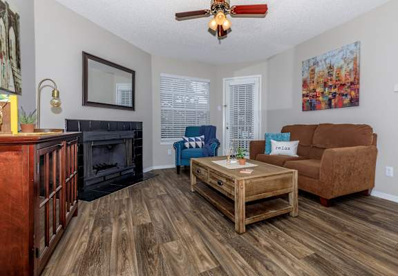 a living room with a couch and a coffee table at The Davis Apartments, Huntsville, 35816