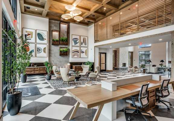 A modern office space with a black and white checkered floor.