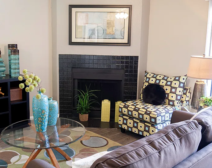 stylish furnishings with wood burning fireplace in unit