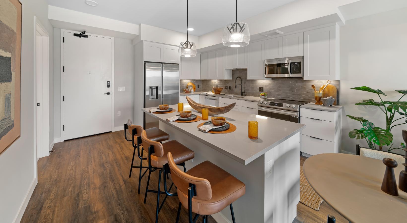 a kitchen with a table and chairs