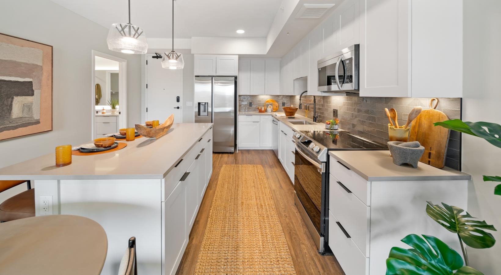 a kitchen with white cabinets