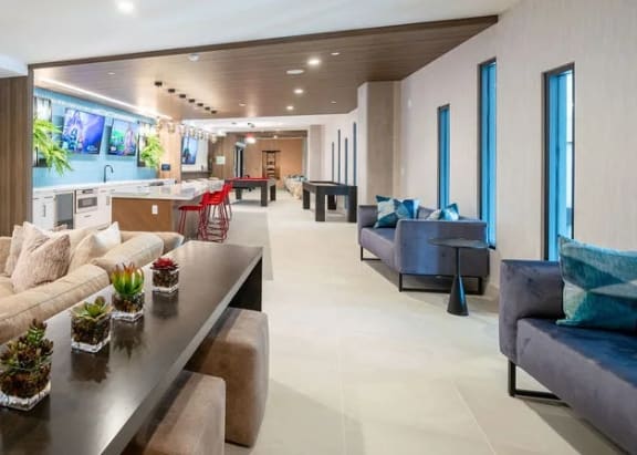 a living room with couches and a table