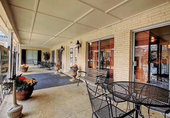 A patio with a table and chairs is shown.