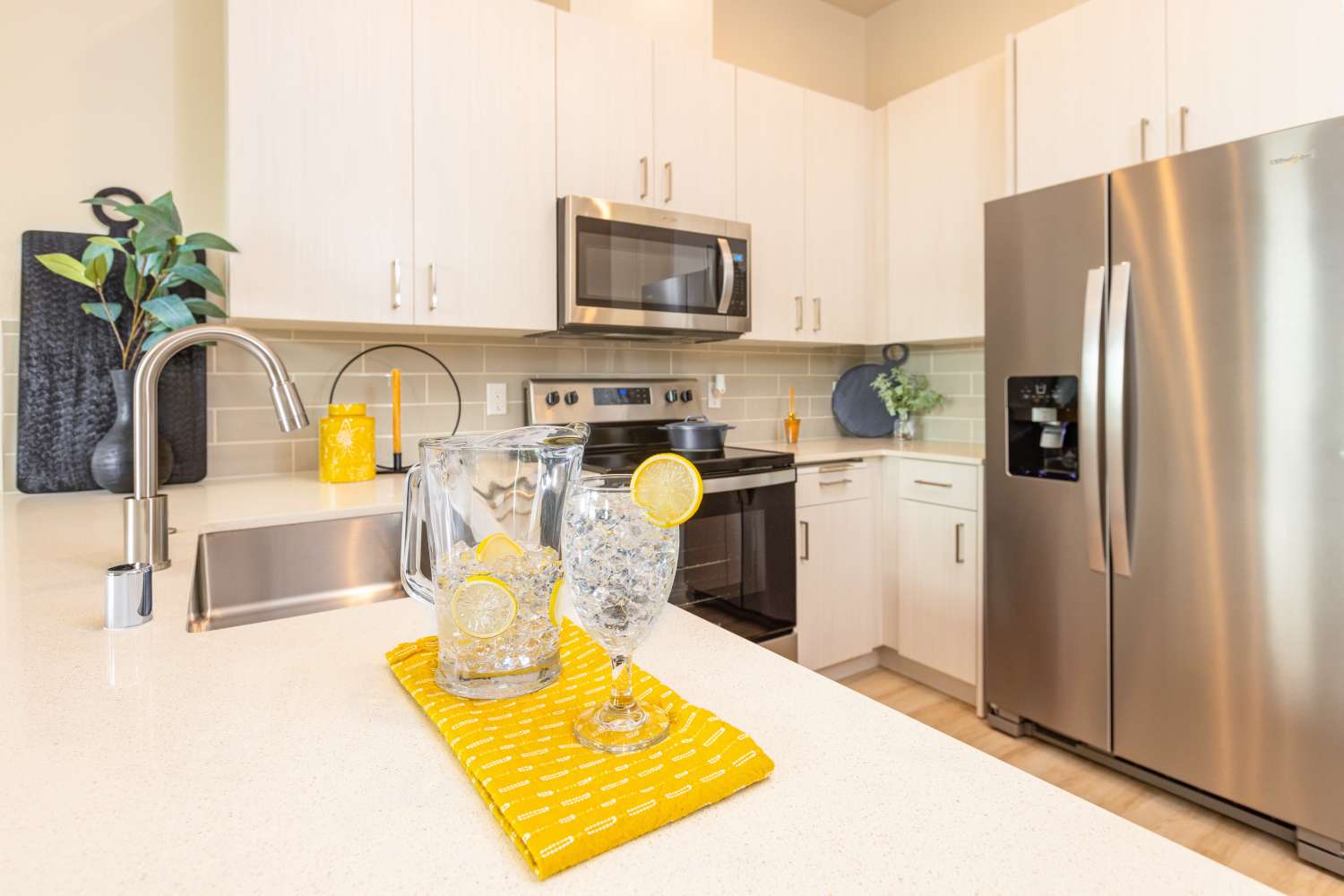 Cozy kitchen with stainless-steel refrigerator at Solasta in Sacramento, California