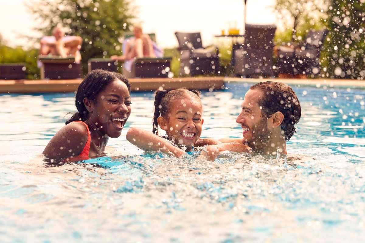 Residents swimming in a pool at Falcon Crest Apartments in Louisville, Kentucky