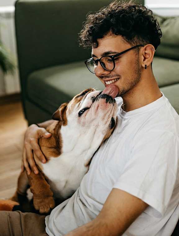 a dog and his owner in a living room at Earle Manor Apartments, Wheaton, Maryland
