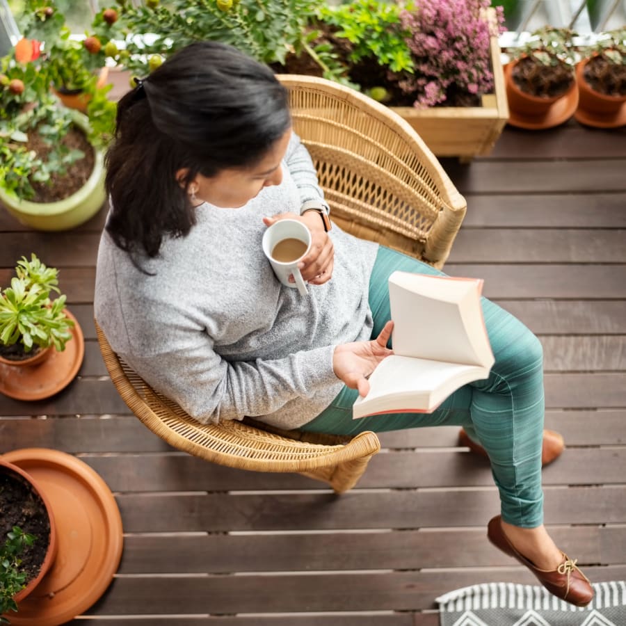 Resident relaxing on her patio at Park Terrace in High Point, North Carolina