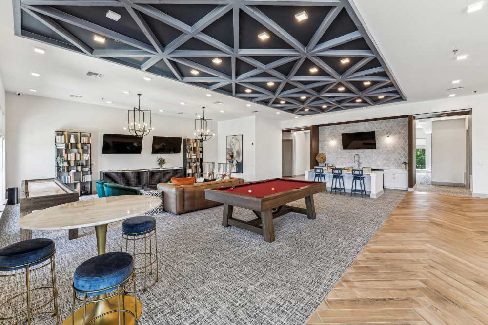 Pool table with effecient lighting and seating area at Mosby Bridge Street in Huntsville, Alabama