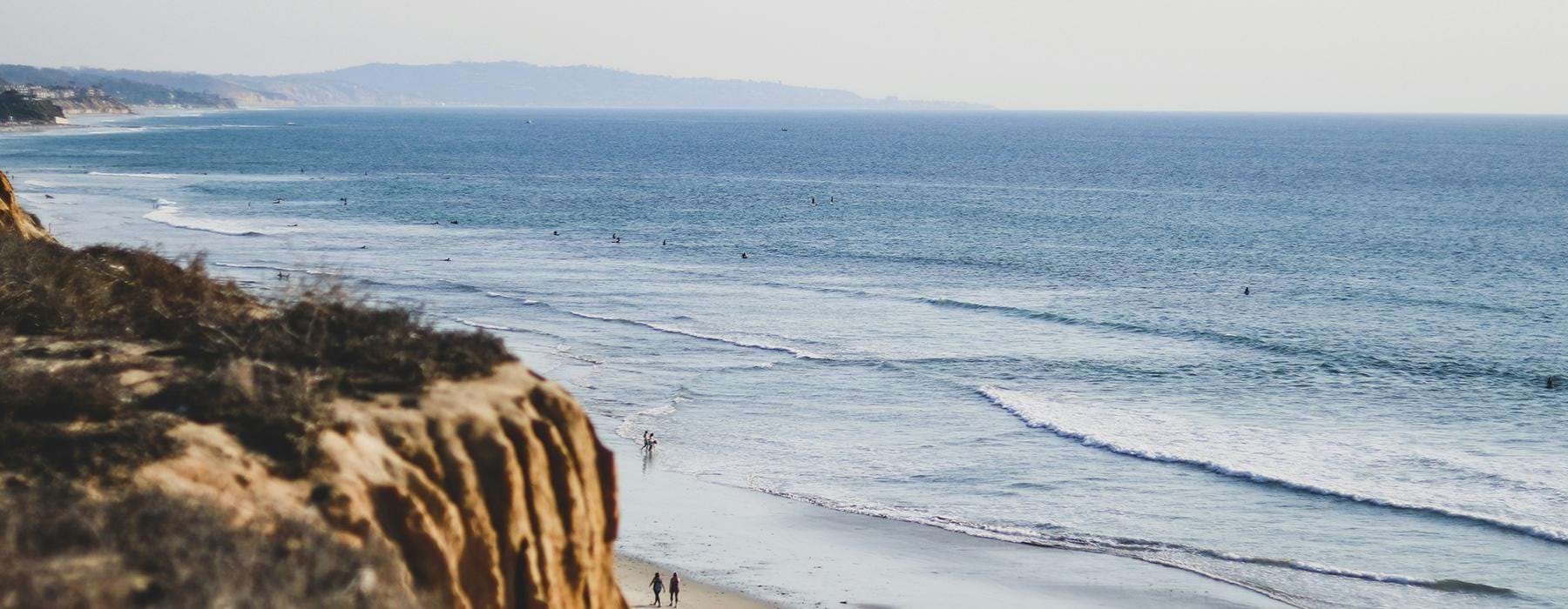 View of the ocean and beach in Carlsbad, CA.