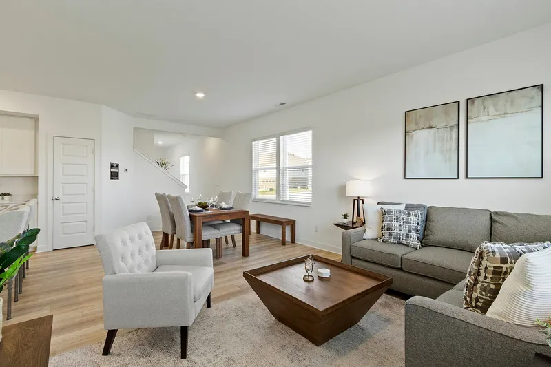 Furnished living room with the dining room behind