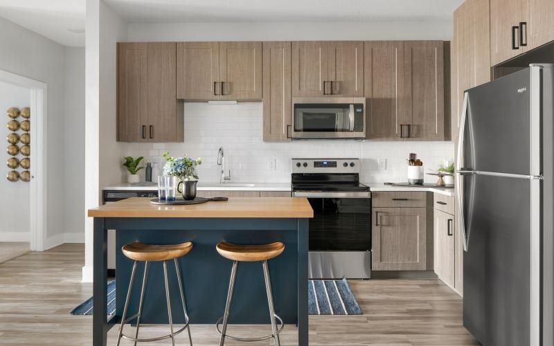 a kitchen with wooden cabinets