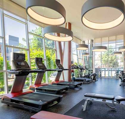 Gym with treadmills, elliptical machines, and other exercise equipment at Astro, Seattle, WA, Washington