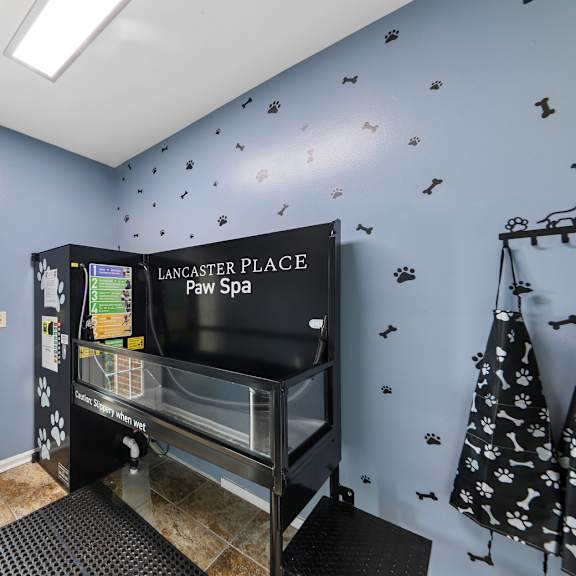 Resident pet spa at Lancaster Place Apartments in Calera, AL with a professional dog washing station and convenient pet grooming area for residents and their pets.