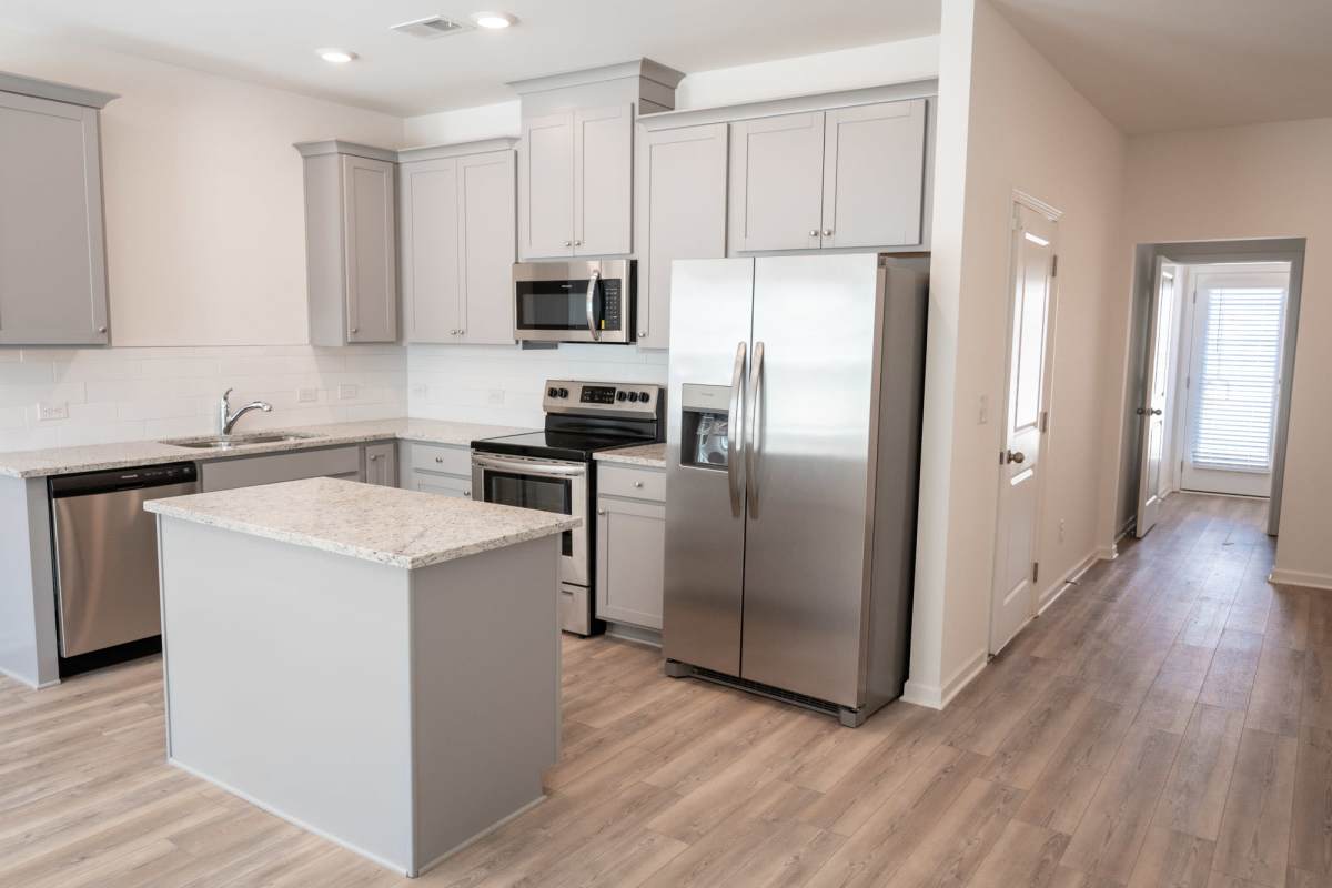 Residents enjoying cooking in their new kitchen at Parallel 36 at Jailette in Atlanta, Georgia
