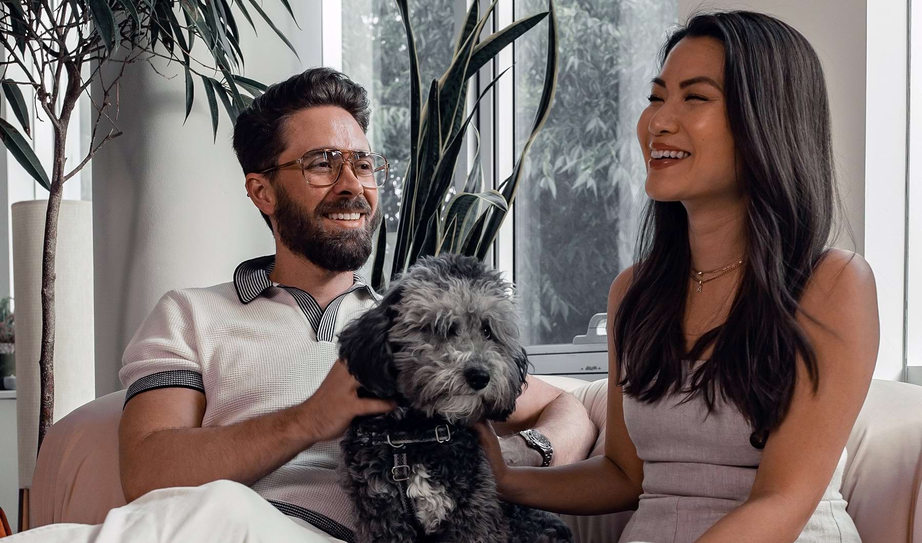 couple on couch with dog