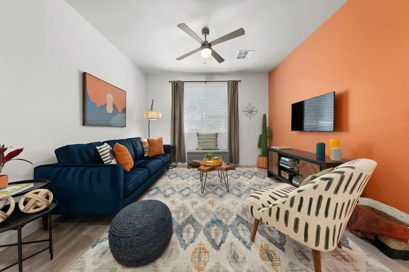 Furnished living room with couch and chairs
