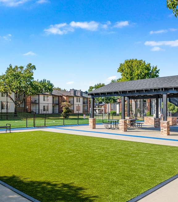 the front of a brick building with green windows  at Water Ridge Apartments , Texas, 75061