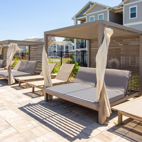 Covered cabanas poolside in oakwood apartments