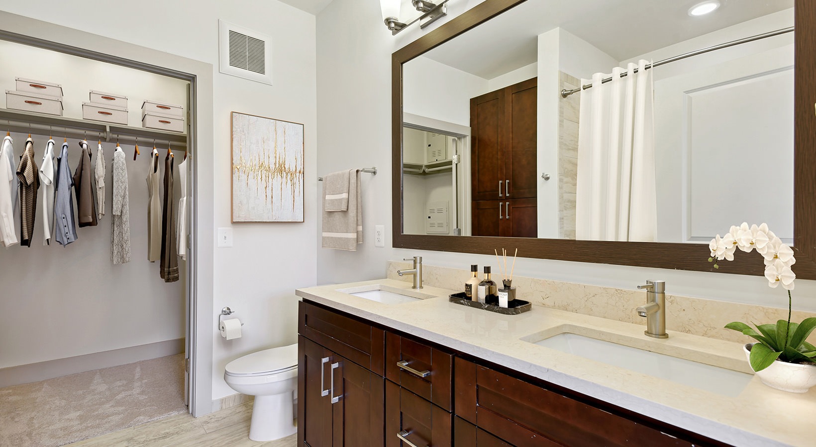 bathroom with sink and large mirror