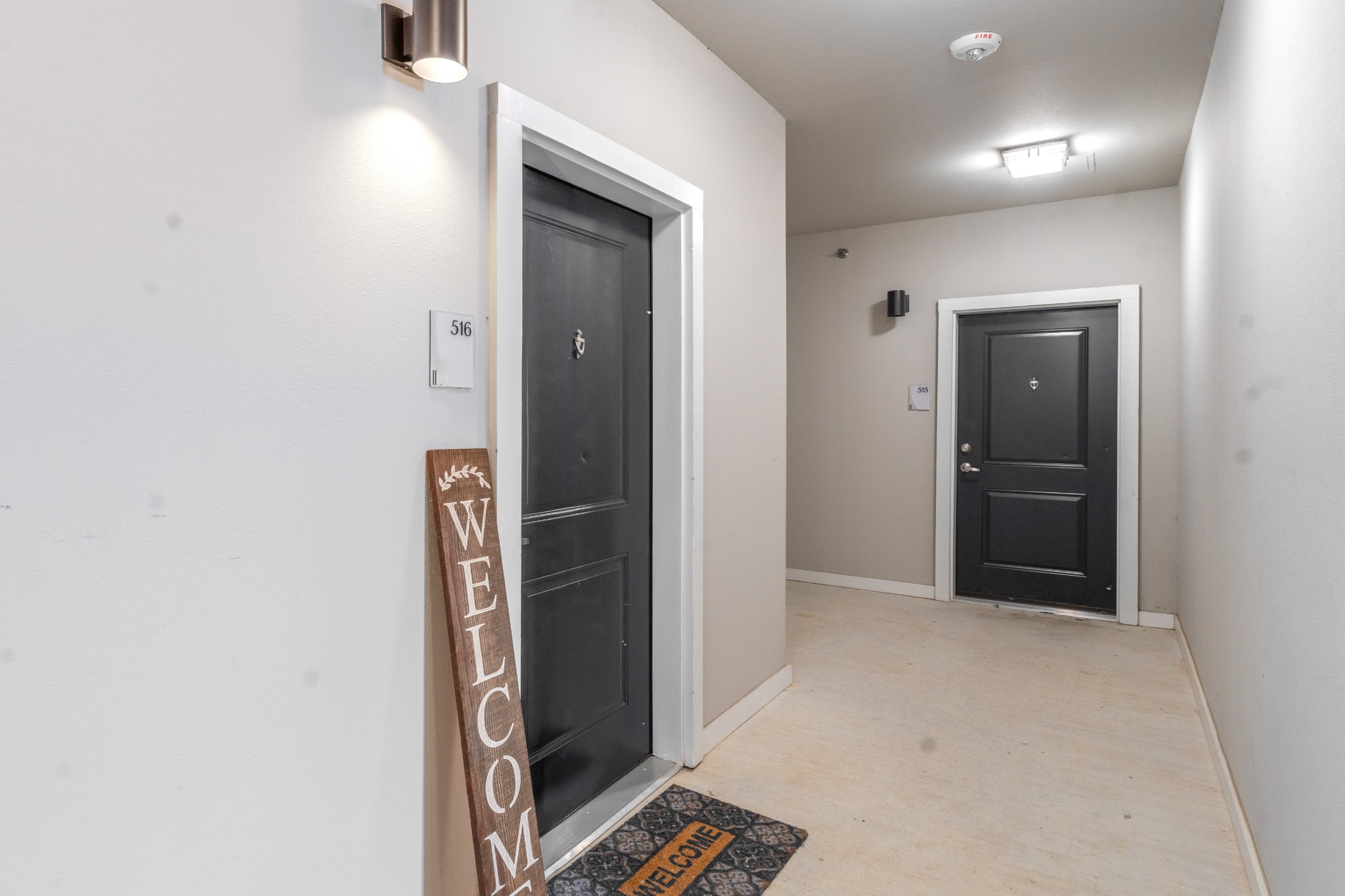 Exterior view of apartment front doors in Landmark at Crowley's communtiy