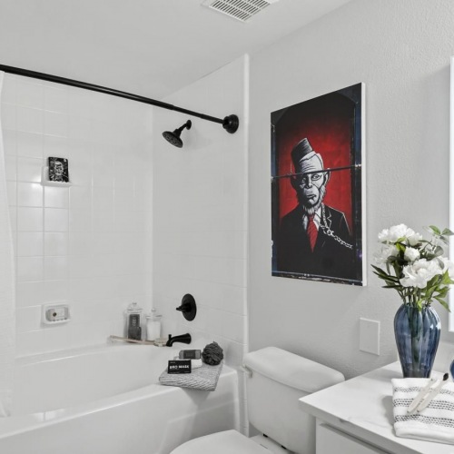 a bathroom with a shower toilet sink and mirror