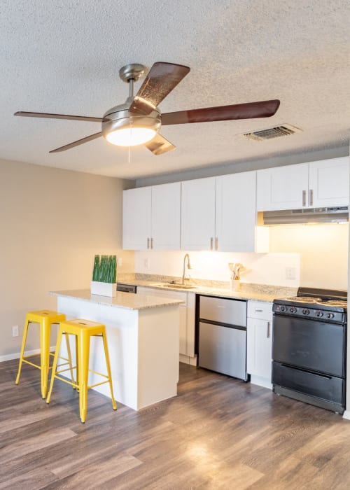 Kitchen with an island at The Iris in San Antonio, Texas