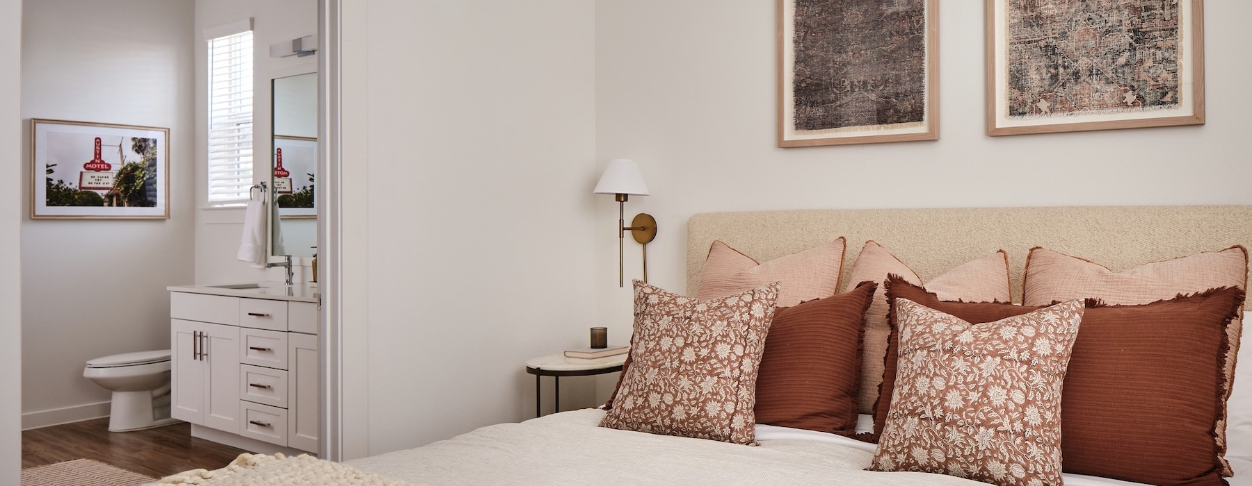 Spacious bedroom with contemporary wall art in Citizen House Decker apartments, Austin, TX