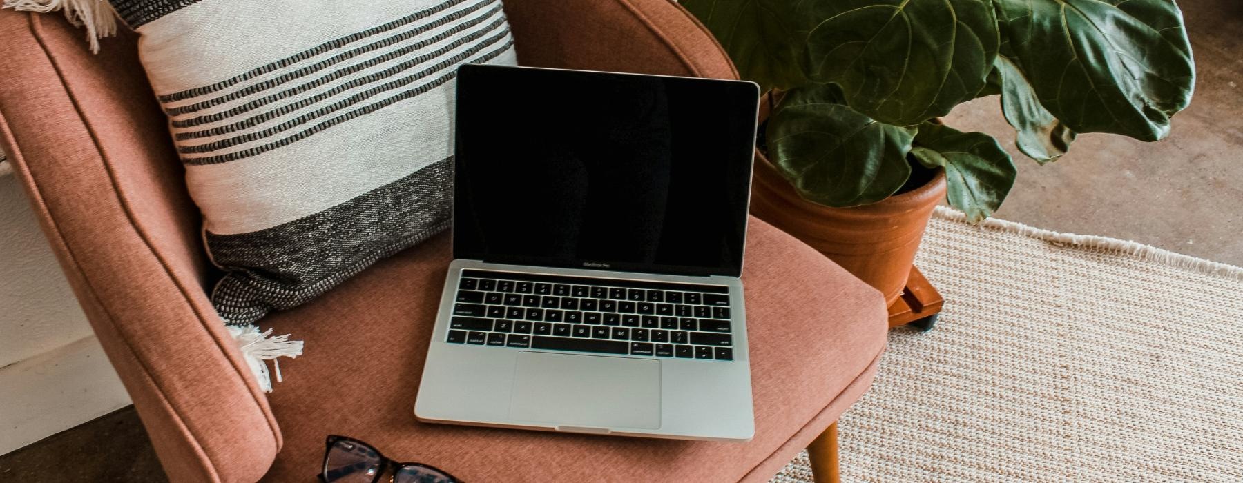 a laptop on a chair