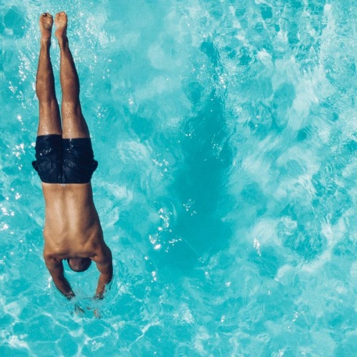 a person diving in a pool