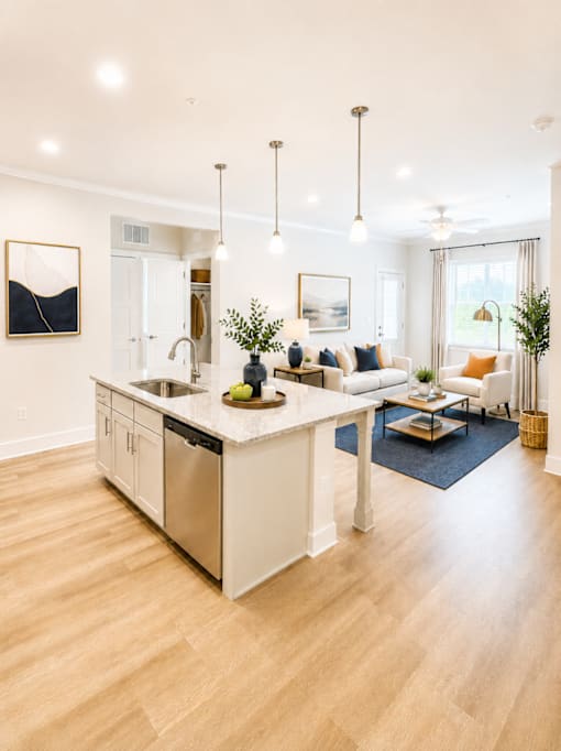 A modern kitchen with a large island and a dining area.