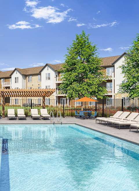 A Pool with Lounge Chairs at Anson Crossing Apartments, Maxwell, TX