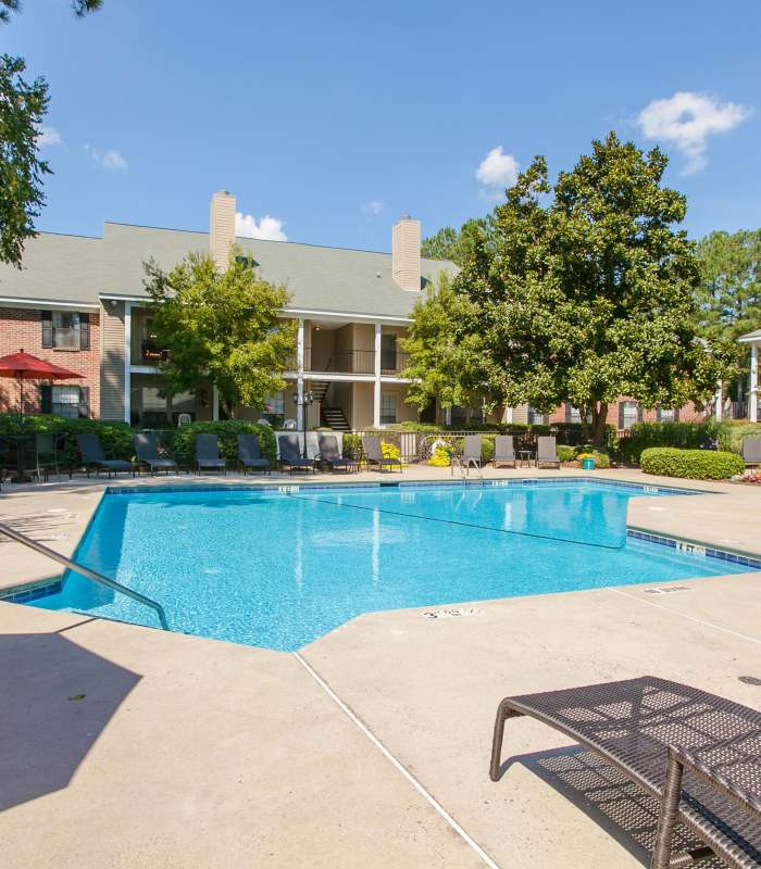 Resort-style pool with lounge chairs at Marks Church Commons in Augusta, Georgia