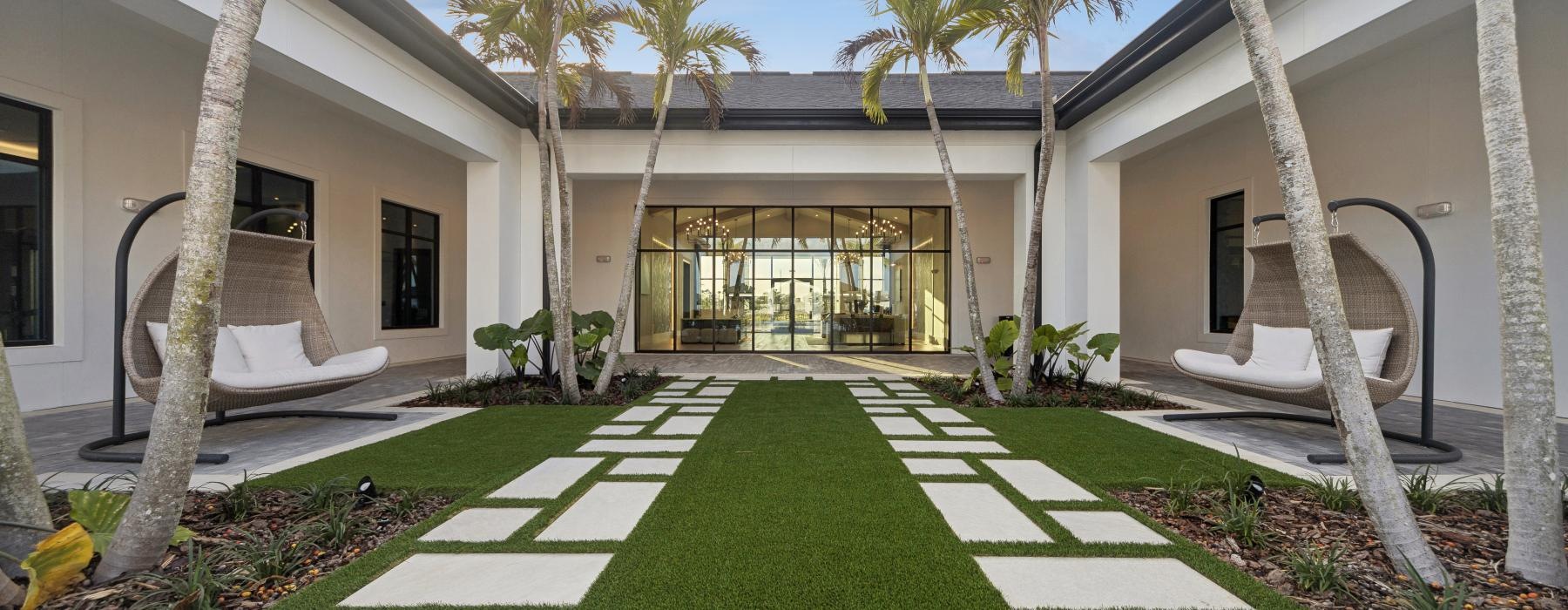 a courtyard with trees and seating options