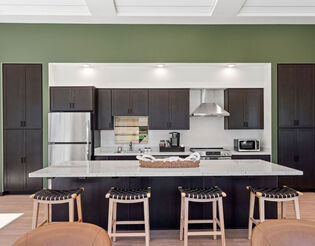 Communal kitchenette in lobby with seating