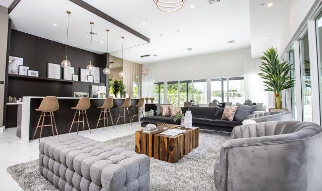 a spacious room with a large chandelier and a couch
