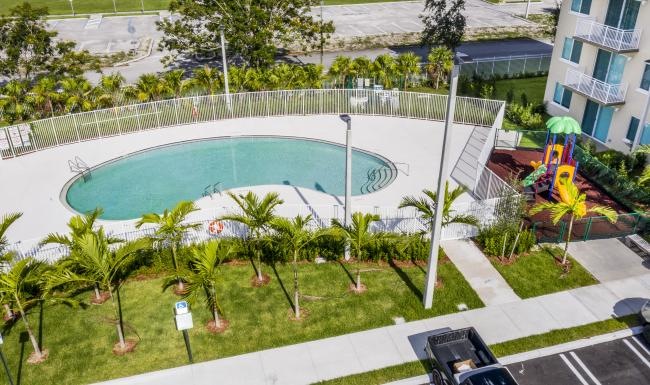 a pool with a building in the background