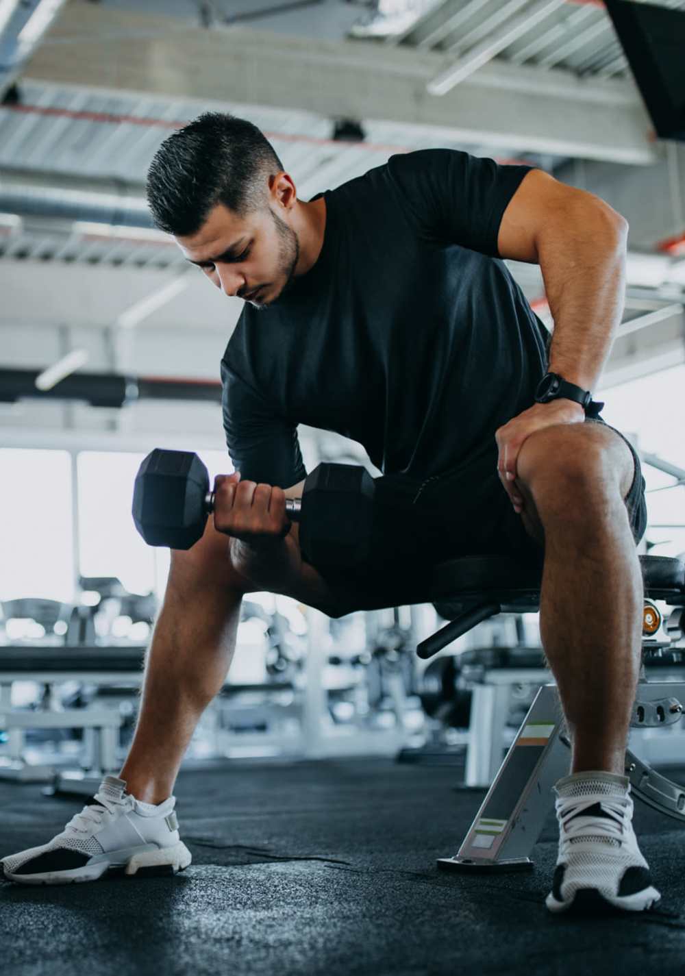 Resident doing work out in the fitness center at The Garnett in Brooklyn, New York
