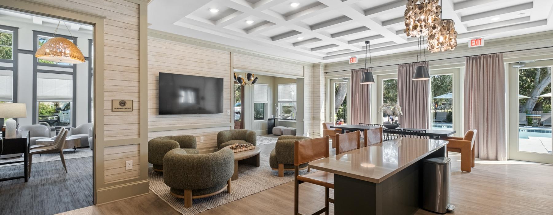a large room with a wood floor and a large tv