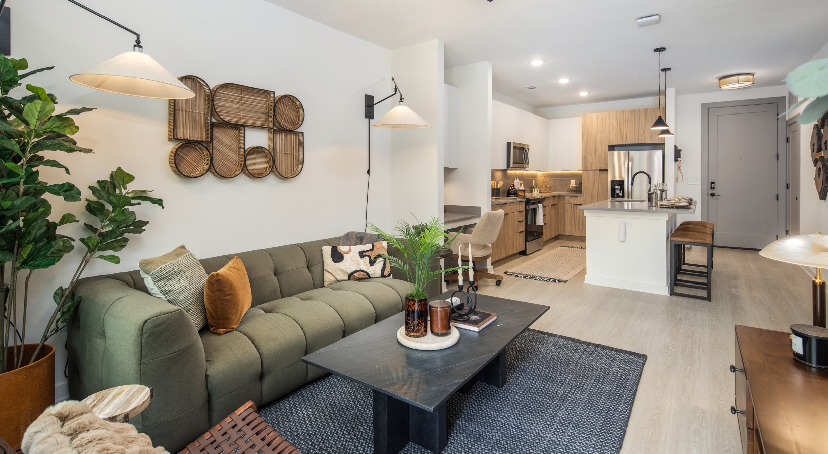 a living room with a green couch and a coffee table