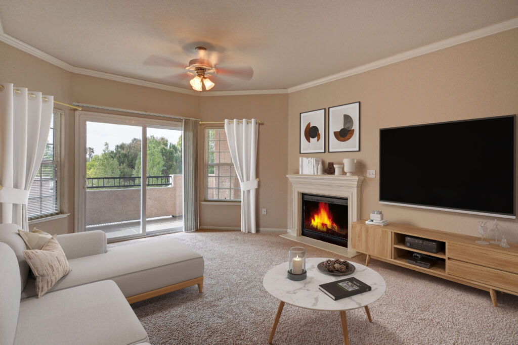 Carpeted living room with fireplace and large windows