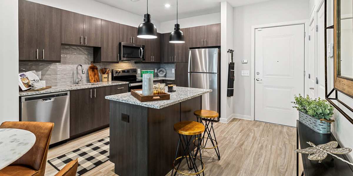 Kitchen with black & stainless-steel appliances at The Reid in Tucker, Georgia