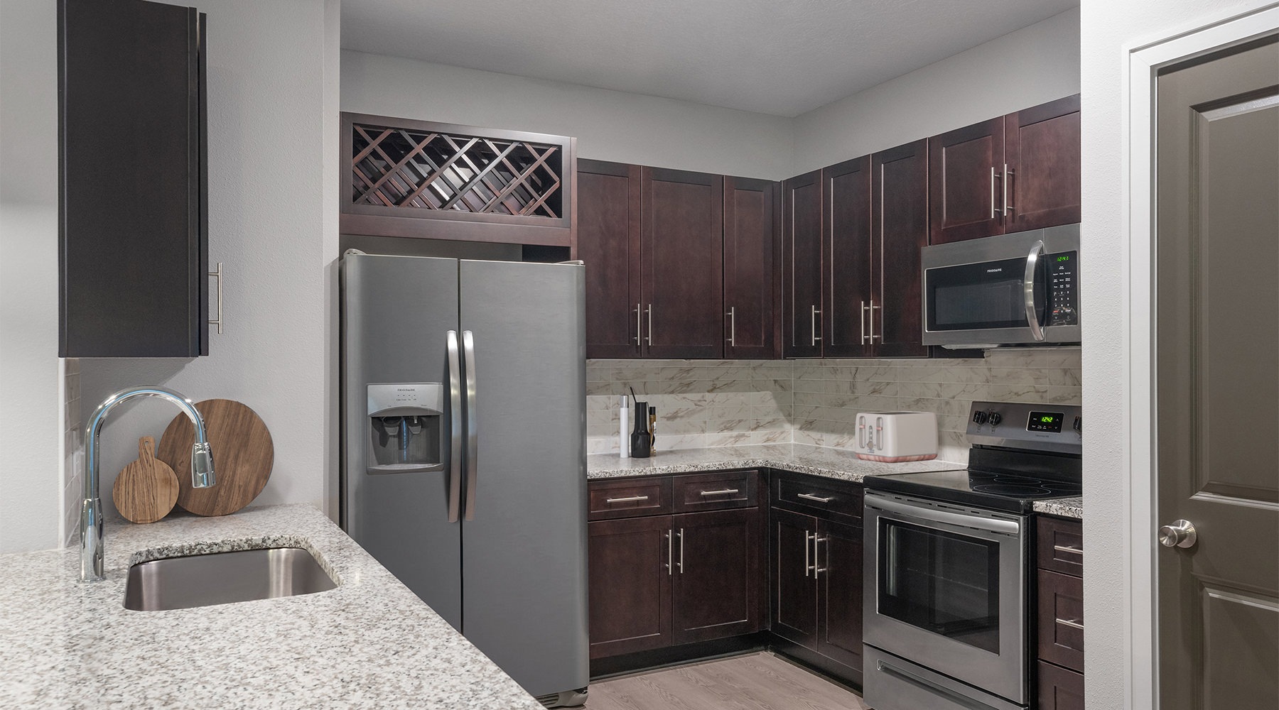 a kitchen with black cabinets