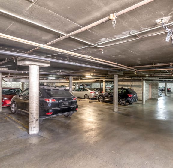 a parking garage with cars parked in it